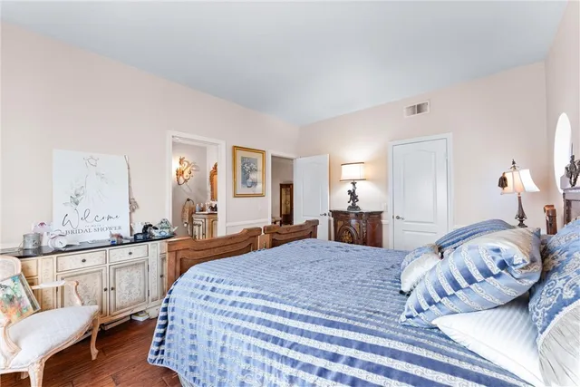 a bedroom with a bed and a couch