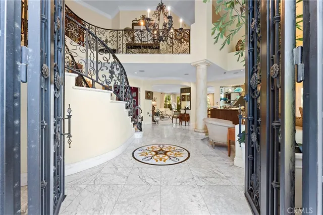a view of a hallway and a dining room with furniture