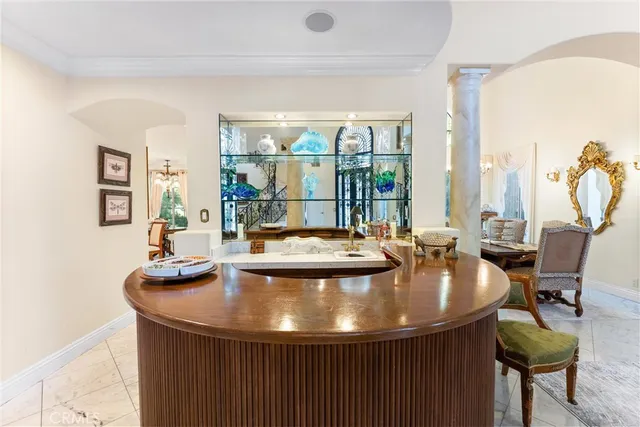 a view of a dining room with furniture wooden floor and a chandelier