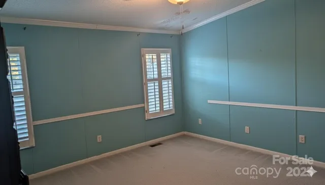 a view of an empty room with windows