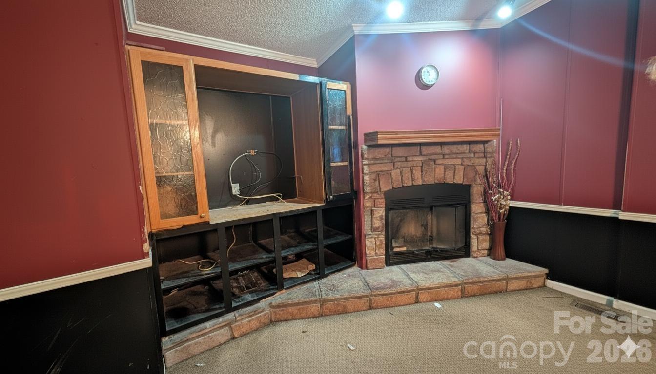 1163 Pit A Tat Road Kershaw, SC 29067 - Photo 13 of 13 a view of a livingroom with a fireplace