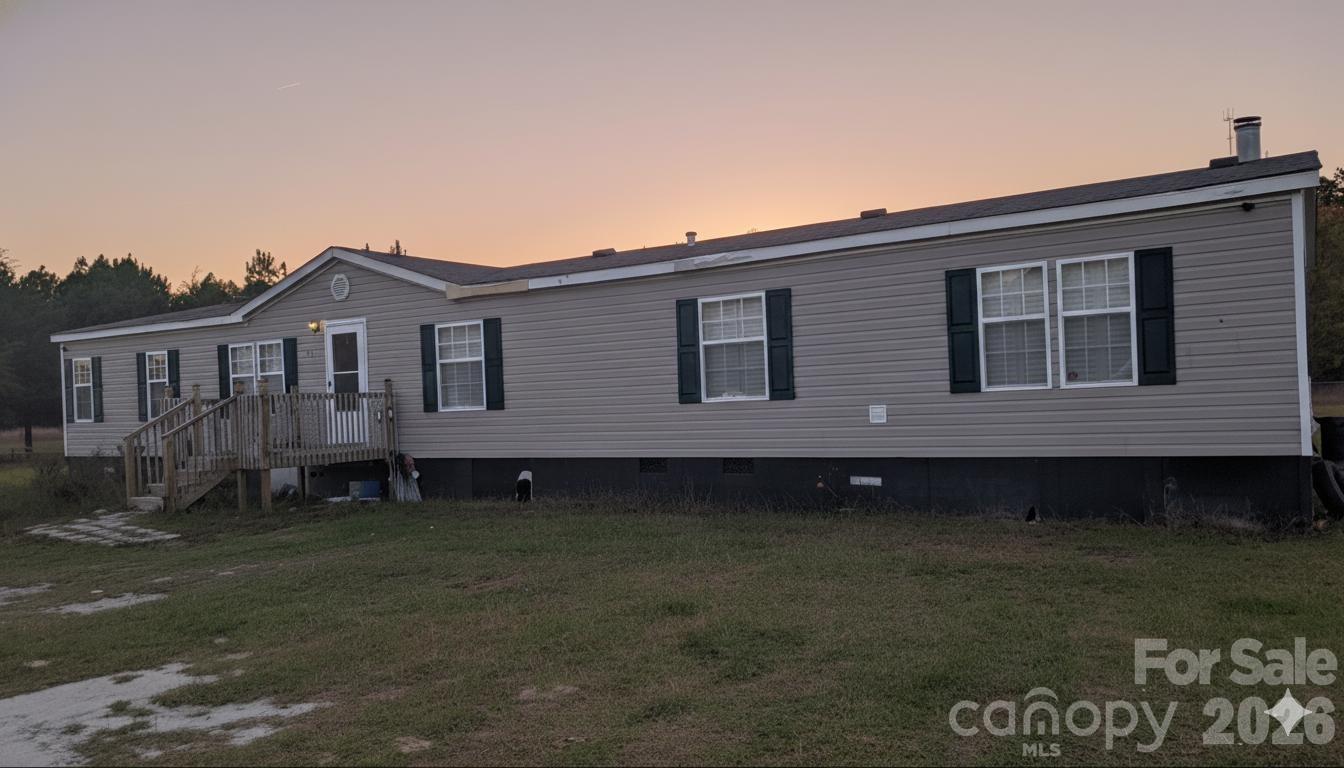 1163 Pit A Tat Road Kershaw, SC 29067 - Photo 5 of 13 a front view of a house with garden