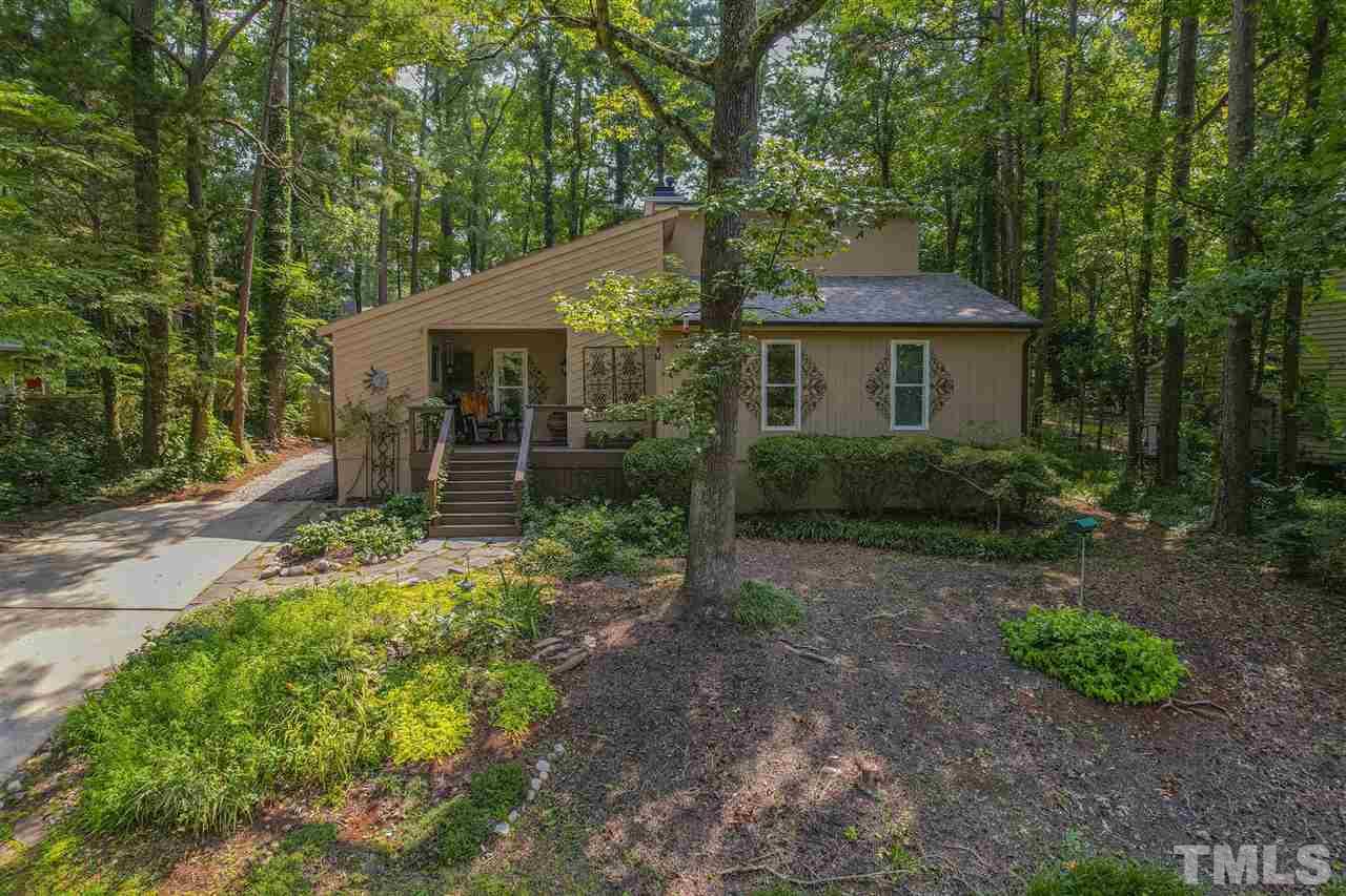 7220 Bluffside Court Raleigh, NC 27615 - Photo 1 of 23 a front view of a house with garden