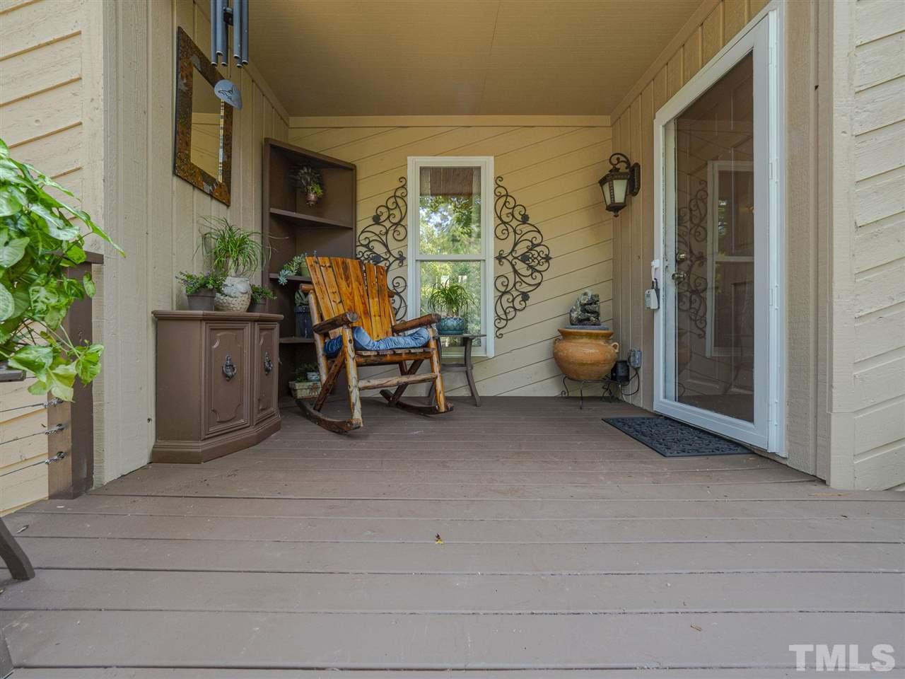 7220 Bluffside Court Raleigh, NC 27615 - Photo 2 of 23 a view of living room filled with furniture and a potted plant