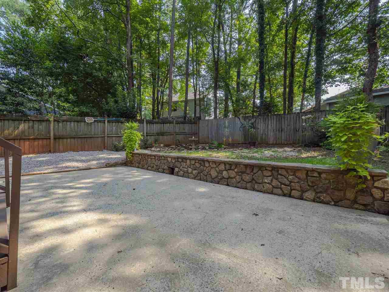 7220 Bluffside Court Raleigh, NC 27615 - Photo 18 of 23 a view of a backyard with trees