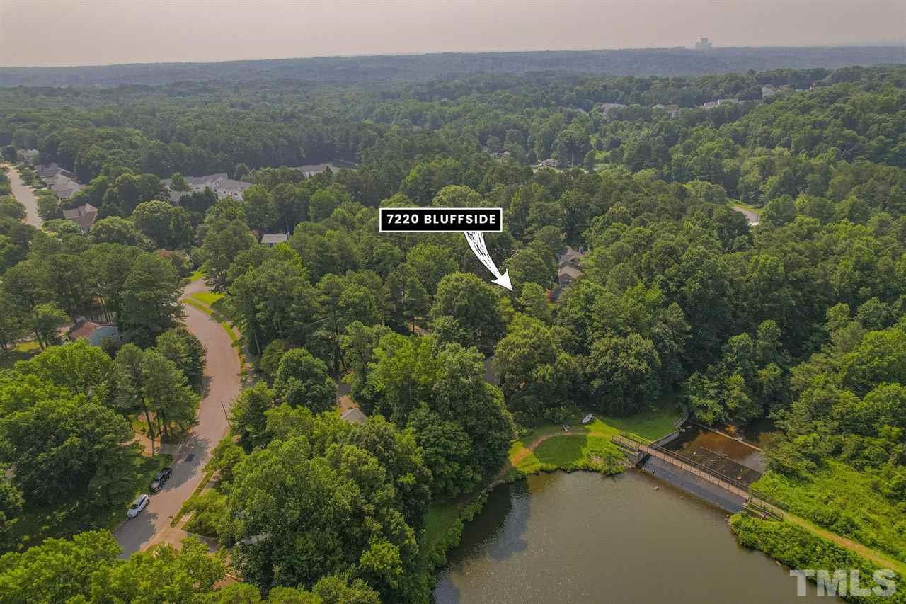 7220 Bluffside Court Raleigh, NC 27615 - Photo 23 of 23 a view of a city with lush green forest