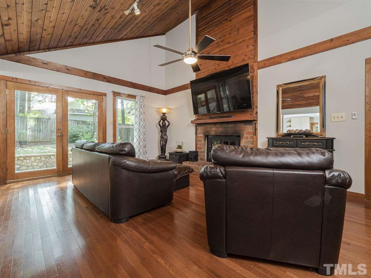 7220 Bluffside Court Raleigh, NC 27615 - Photo 4 of 23 a living room with furniture and a fireplace