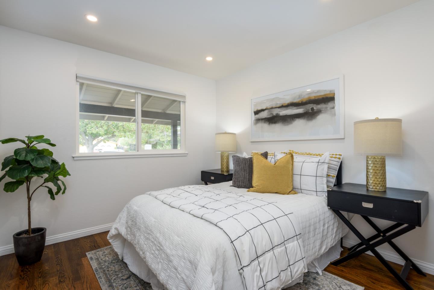 1420 South Mary Avenue Sunnyvale, CA 94087 - Photo 19 of 24 a bedroom with a bed and a window