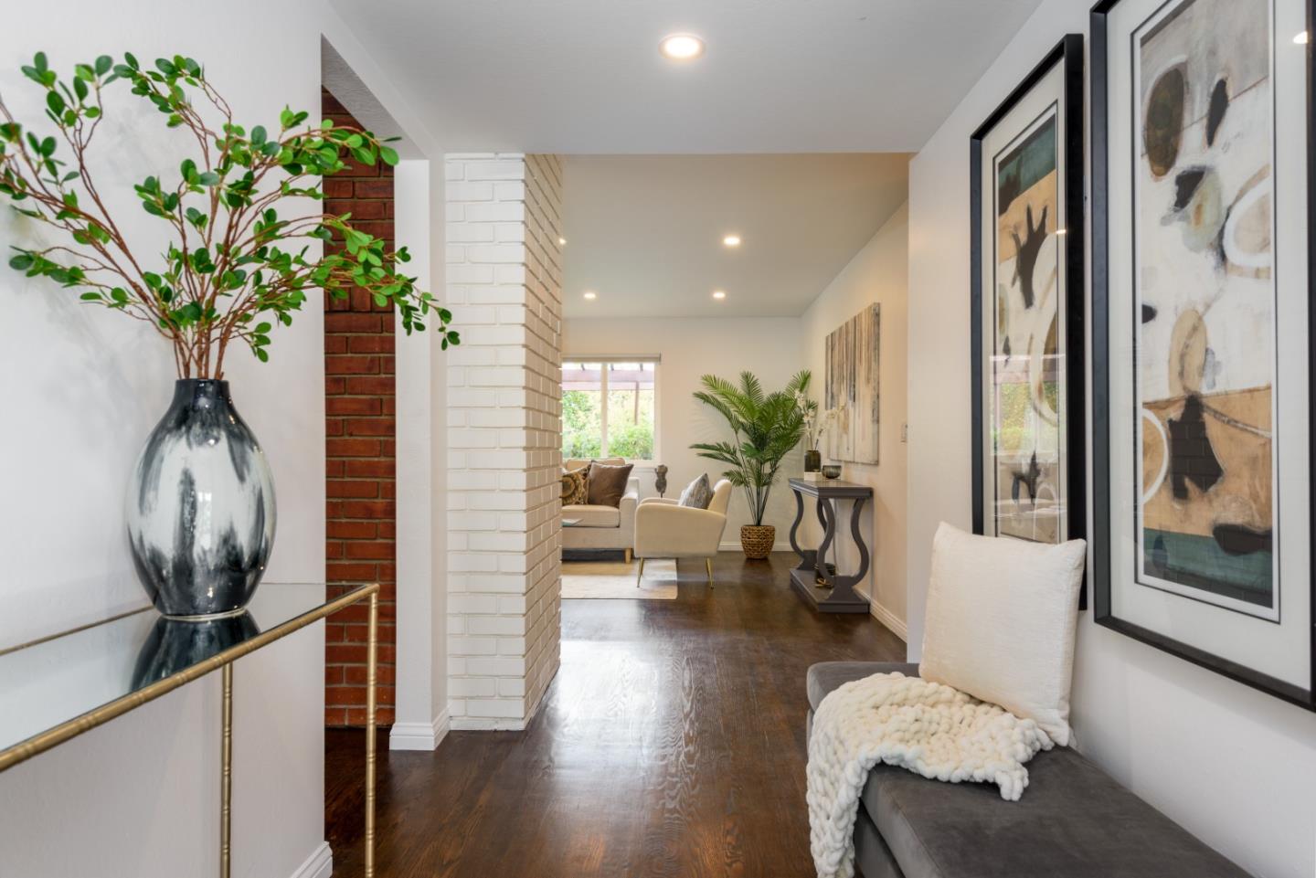 1420 South Mary Avenue Sunnyvale, CA 94087 - Photo 2 of 24 a living room with furniture and a chandelier