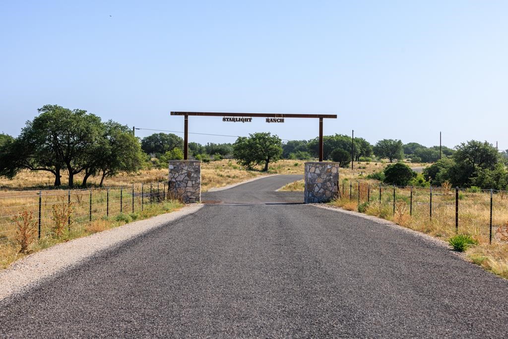 1249 Lester Ln Junction, Unit 18 Junction, TX 76849 - Photo 2 of 19 a view of a swimming pool with a patio