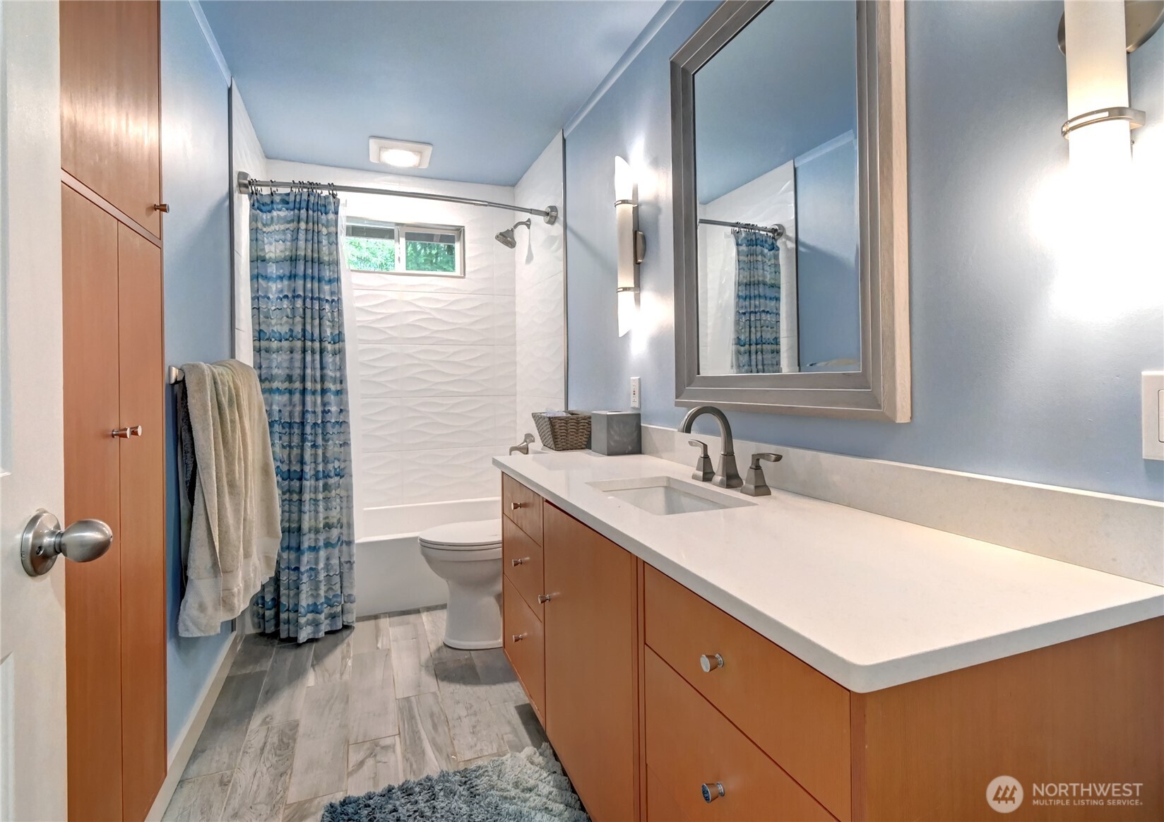 28539 Northeast Tolt Hill Road Carnation, WA 98014 - Photo 24 of 36 a bathroom with a sink a toilet a mirror and shower