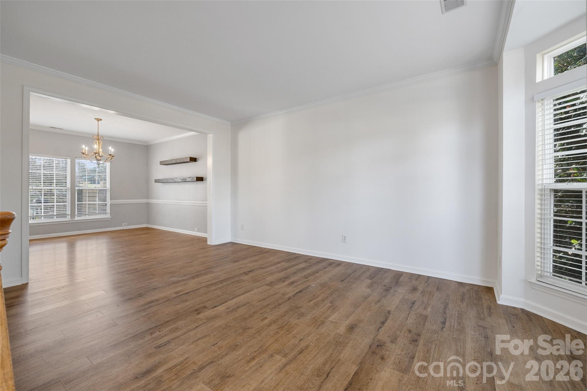 813 Circle Trace Road Monroe, NC 28110 - Photo 12 of 37 wooden floor in an empty room with a window