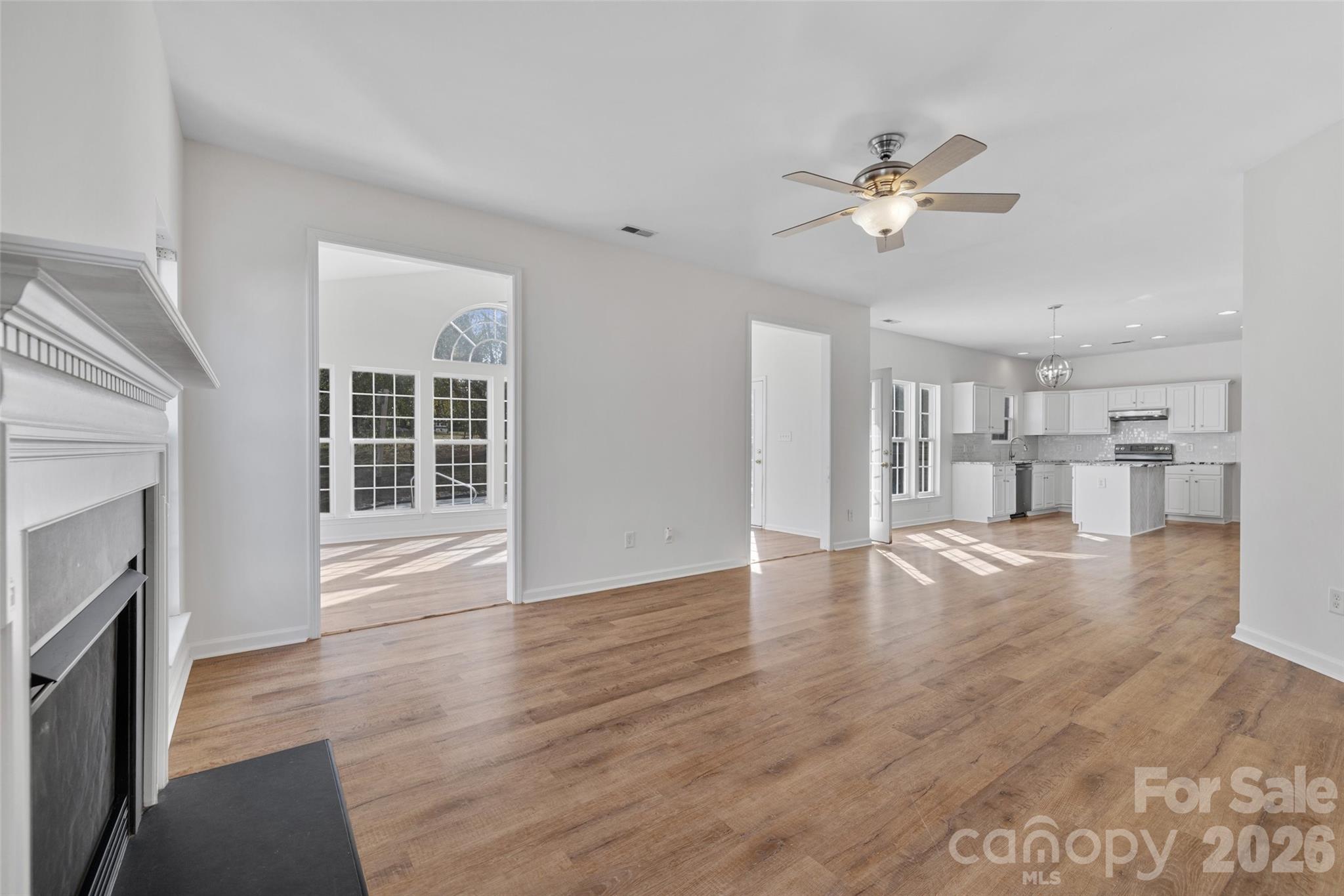 813 Circle Trace Road Monroe, NC 28110 - Photo 16 of 37 a view of empty room with wooden floor and fan