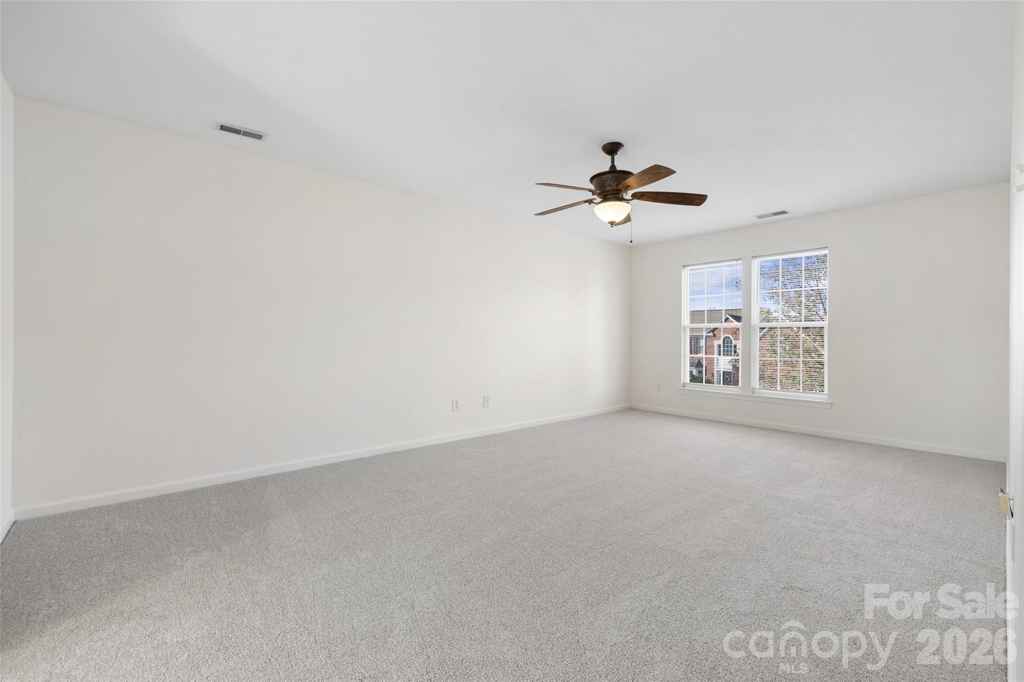 813 Circle Trace Road Monroe, NC 28110 - Photo 22 of 37 wooden floor in an empty room with a window