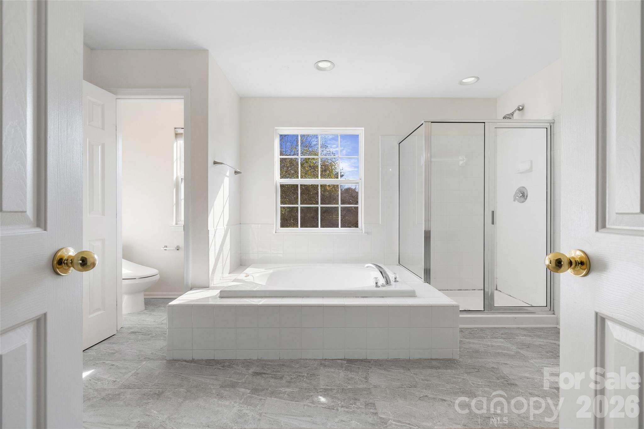 813 Circle Trace Road Monroe, NC 28110 - Photo 23 of 37 a bathroom with bathtub and shower