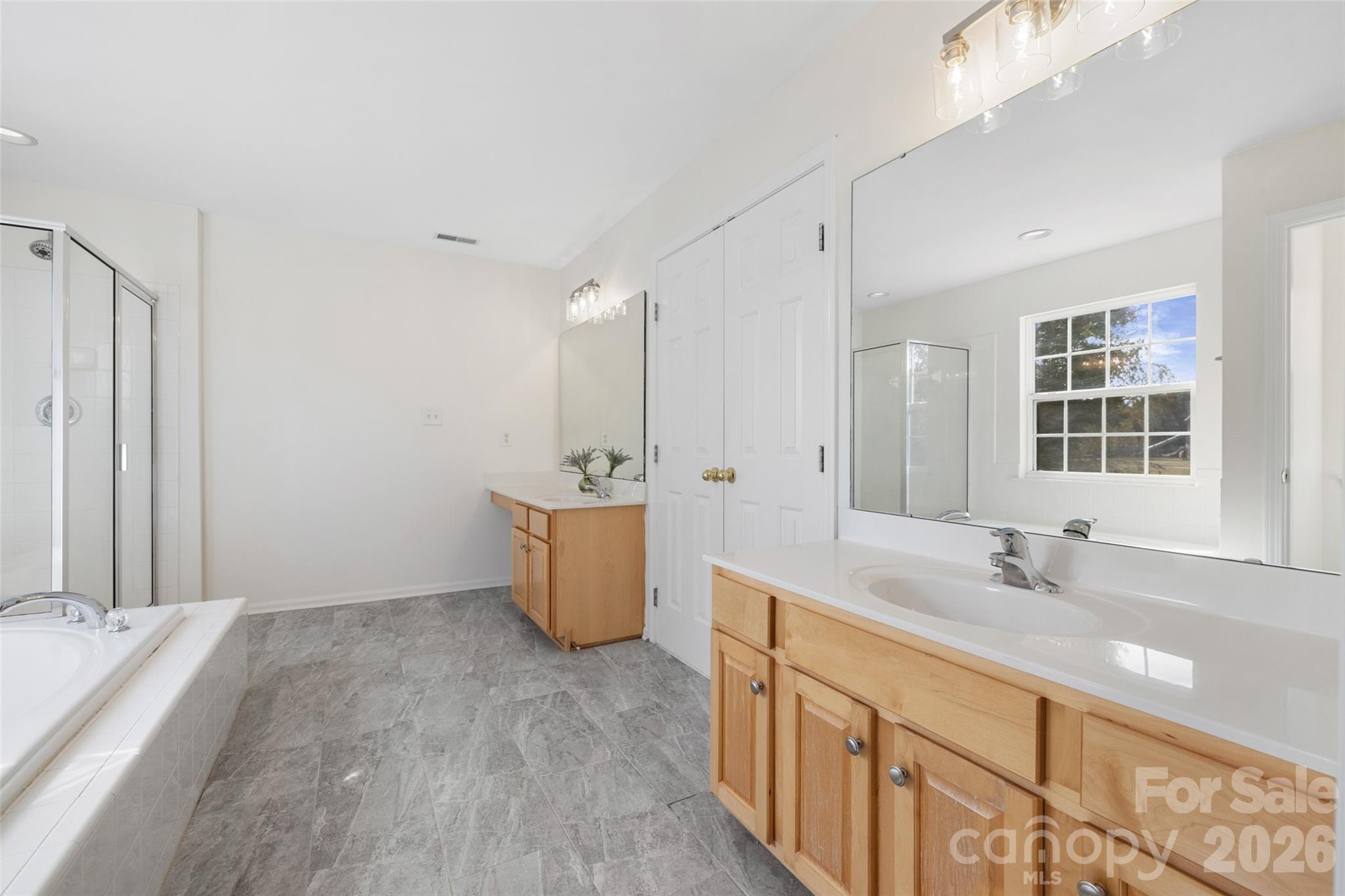 813 Circle Trace Road Monroe, NC 28110 - Photo 24 of 37 a bathroom with a tub sink and mirror
