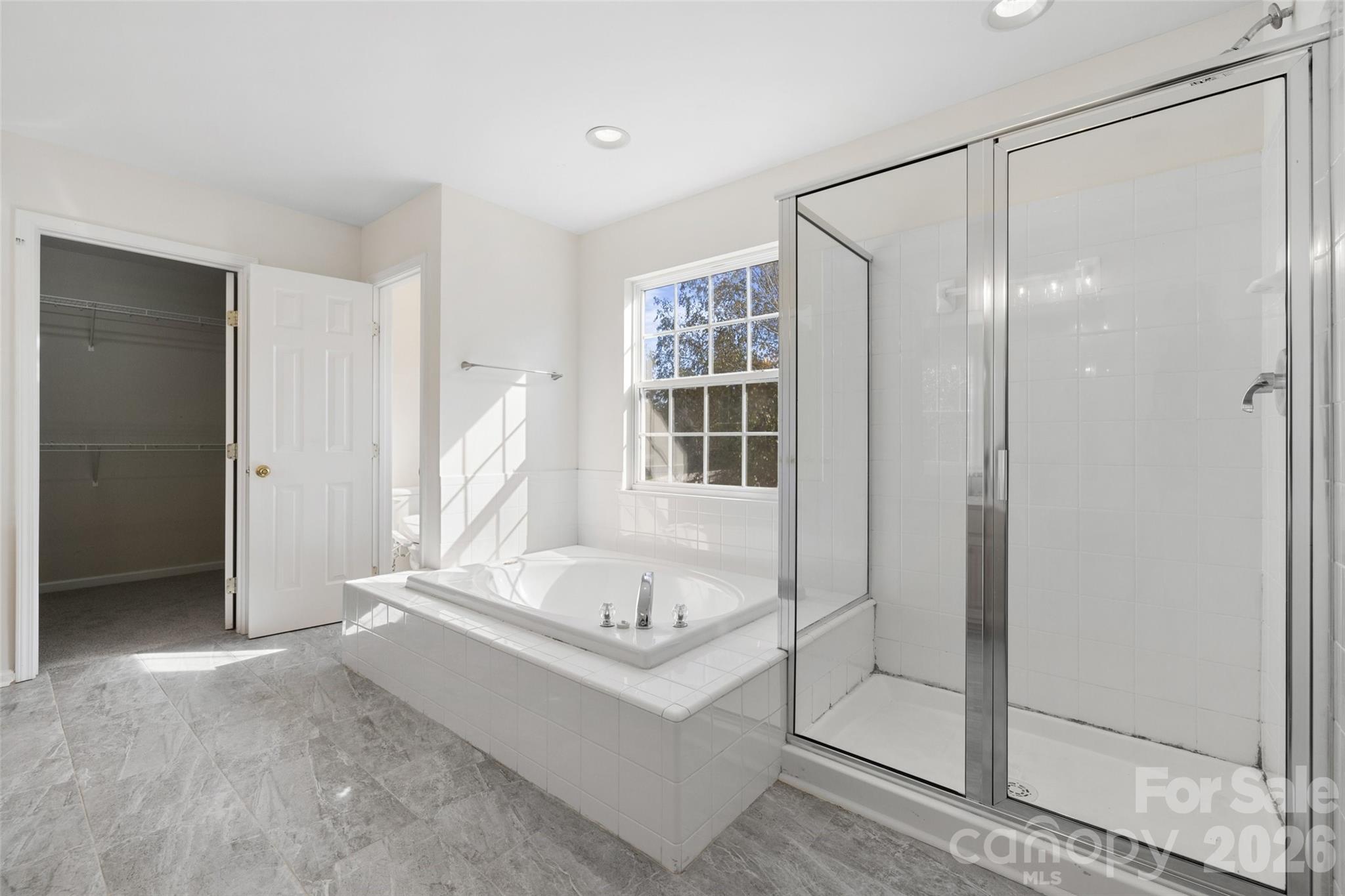 813 Circle Trace Road Monroe, NC 28110 - Photo 25 of 37 a bathroom with a tub and shower