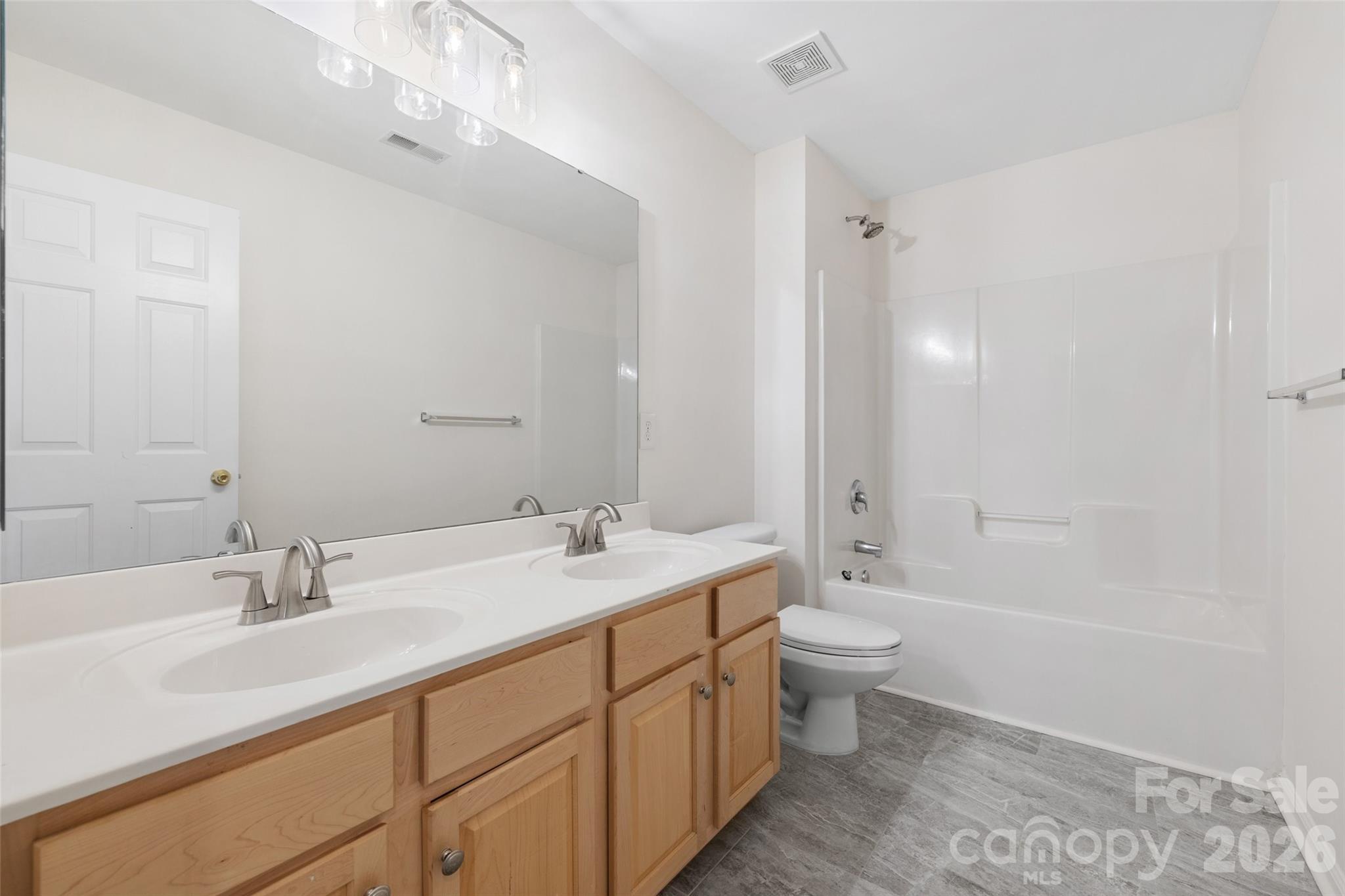 813 Circle Trace Road Monroe, NC 28110 - Photo 30 of 37 a bathroom with a sink a toilet a shower and a mirror