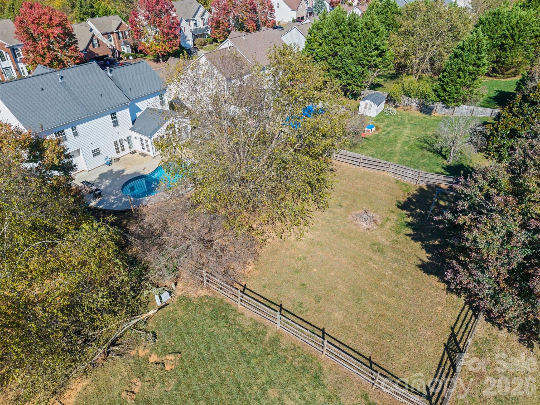 813 Circle Trace Road Monroe, NC 28110 - Photo 3 of 37 an aerial view of a house with a yard and lake view