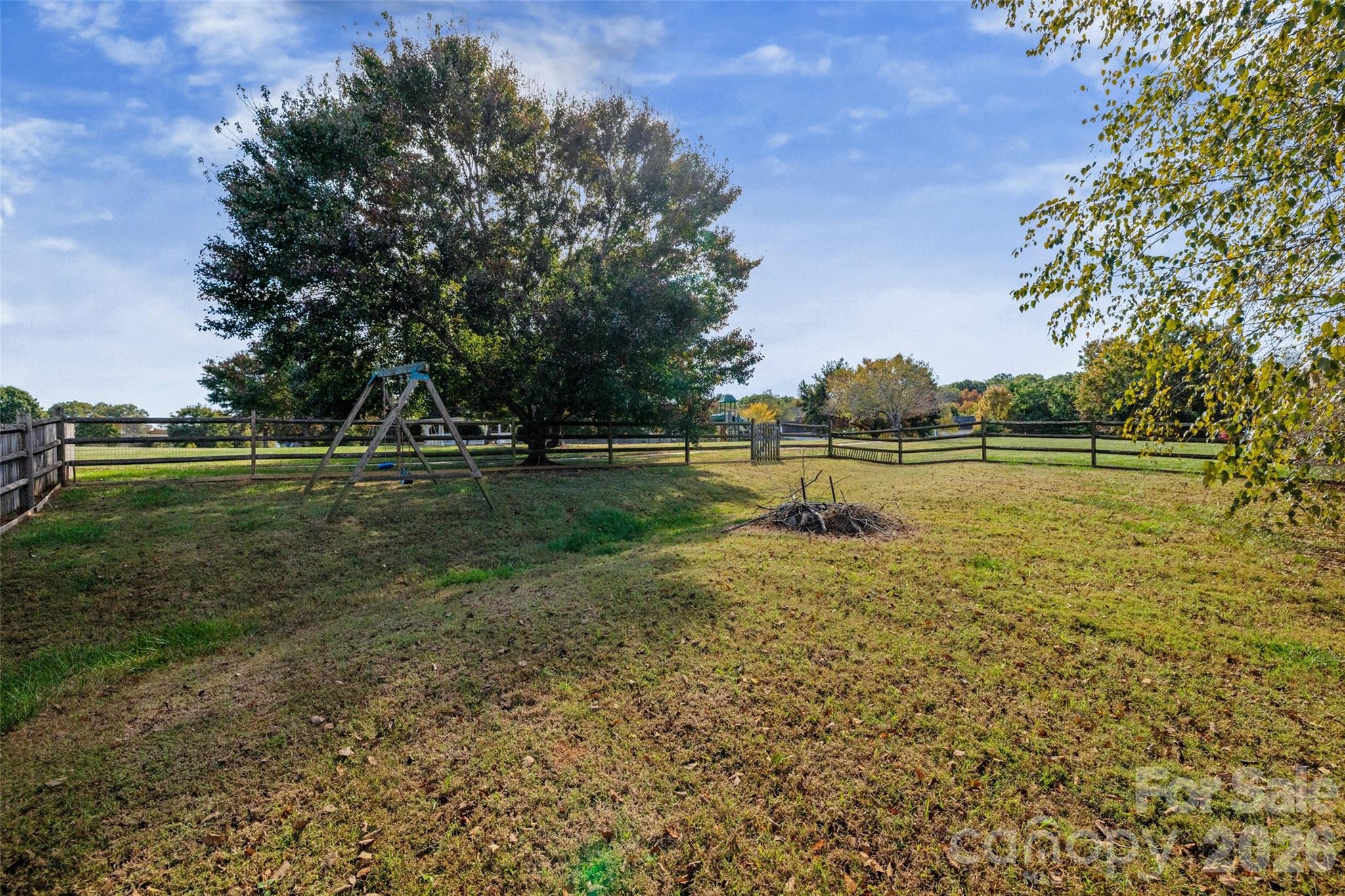 813 Circle Trace Road Monroe, NC 28110 - Photo 32 of 37 a view of a lake with a big yard