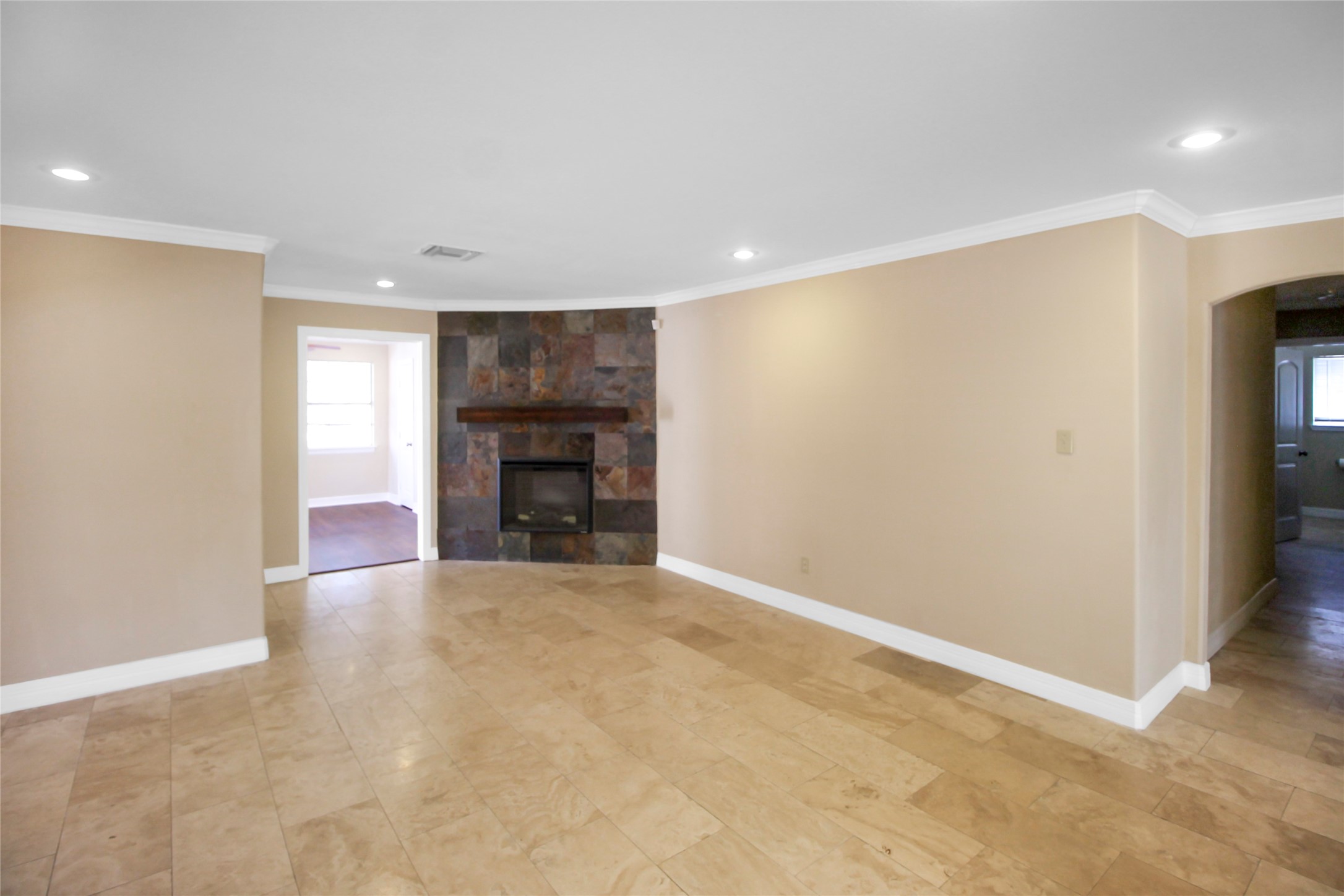 5738 Willowbend Boulevard Houston, TX 77096 - Photo 13 of 28 a view of an empty room with a fireplace
