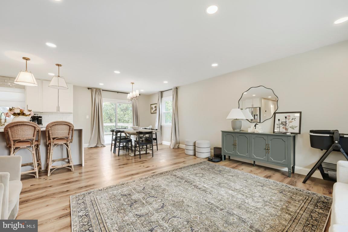 600 East Macphail Road Bel Air, MD 21014 - Photo 15 of 37 a living room with furniture a dining table and a fireplace