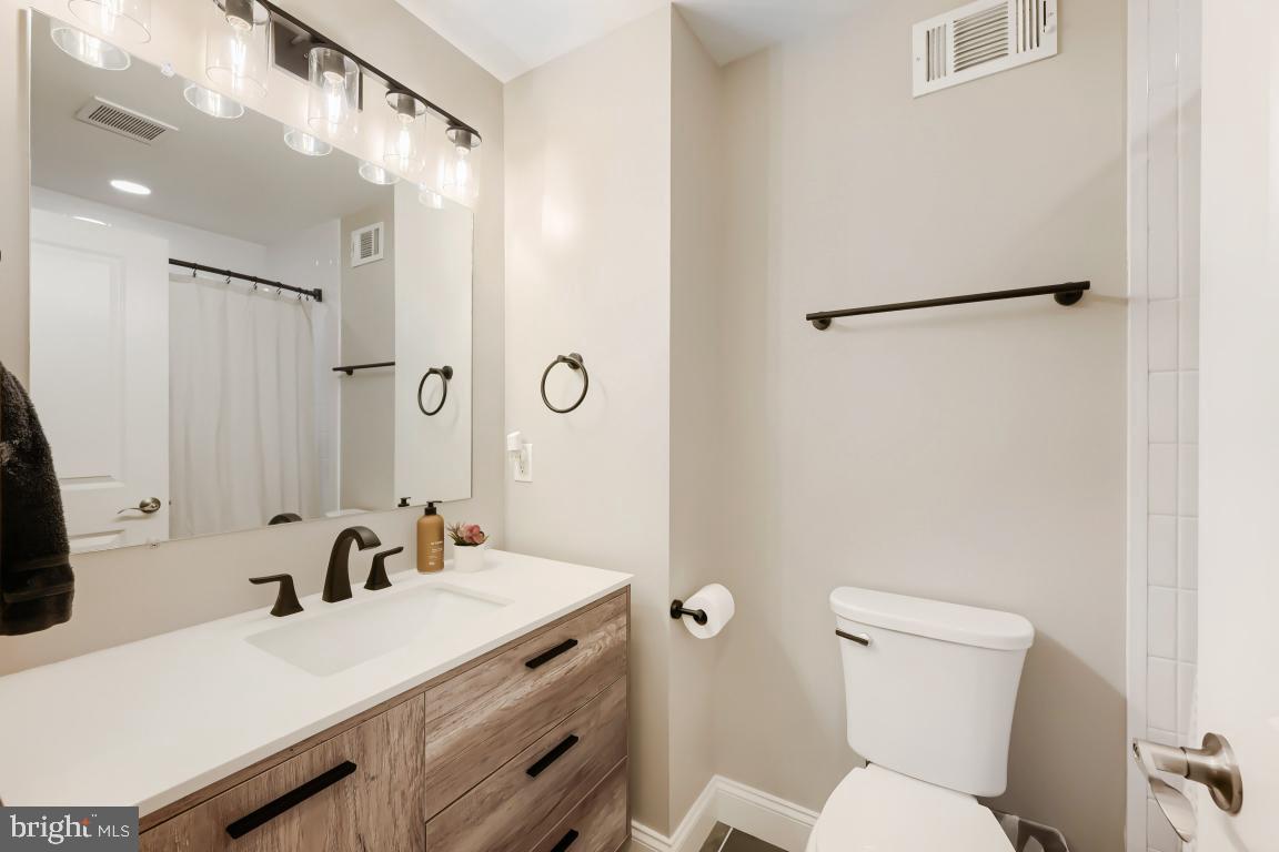 600 East Macphail Road Bel Air, MD 21014 - Photo 22 of 37 a bathroom with a sink vanity mirror and toilet