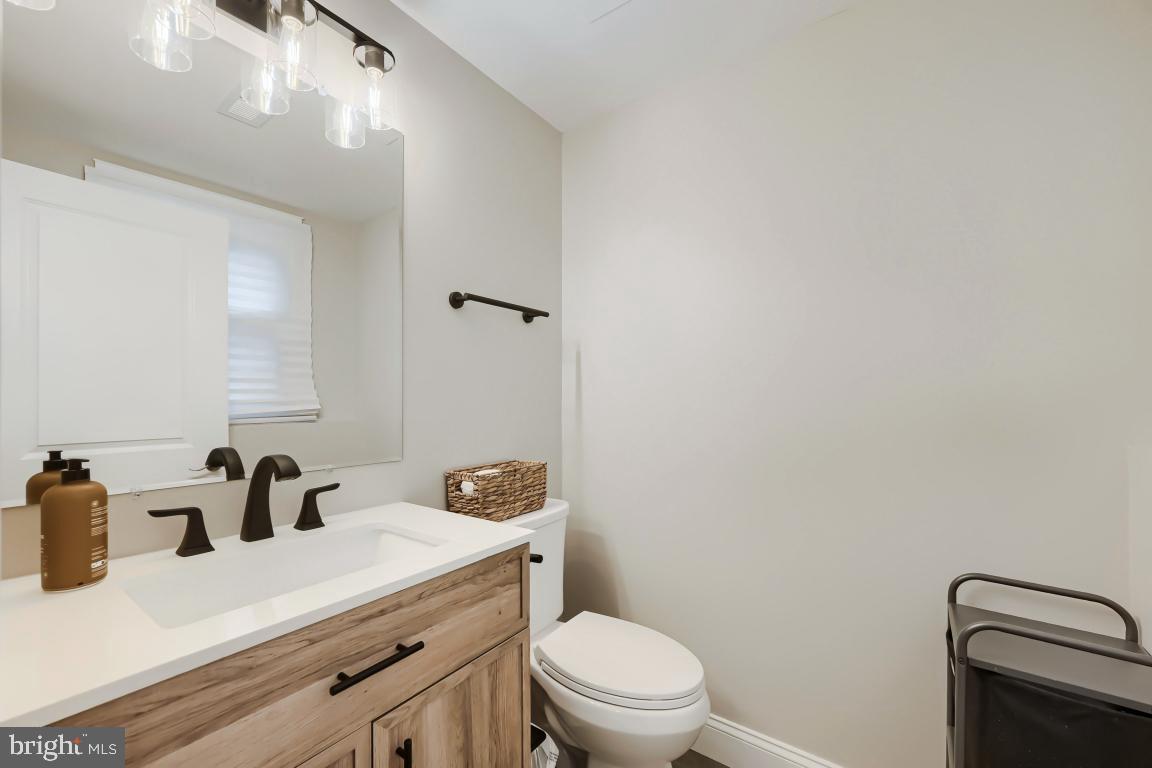 600 East Macphail Road Bel Air, MD 21014 - Photo 28 of 37 a bathroom with a granite countertop sink vanity mirror and toilet