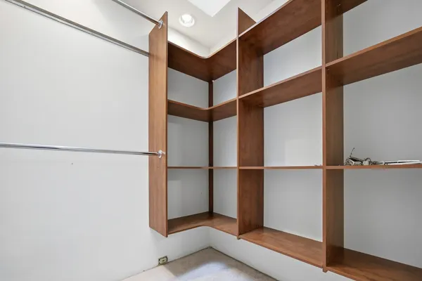 an empty room with white walls and entryway