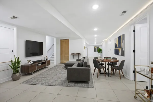 a bathroom with a shower and a glass door