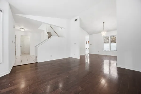 a living room with furniture potted plant and a window