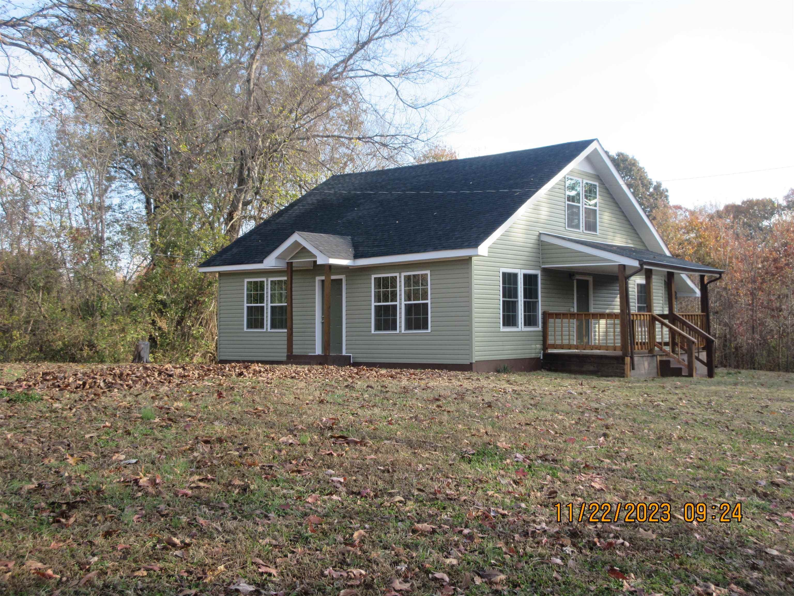 4036 Concord Road Gates, TN 38037 - Photo 2 of 19 a front view of a house with a garden