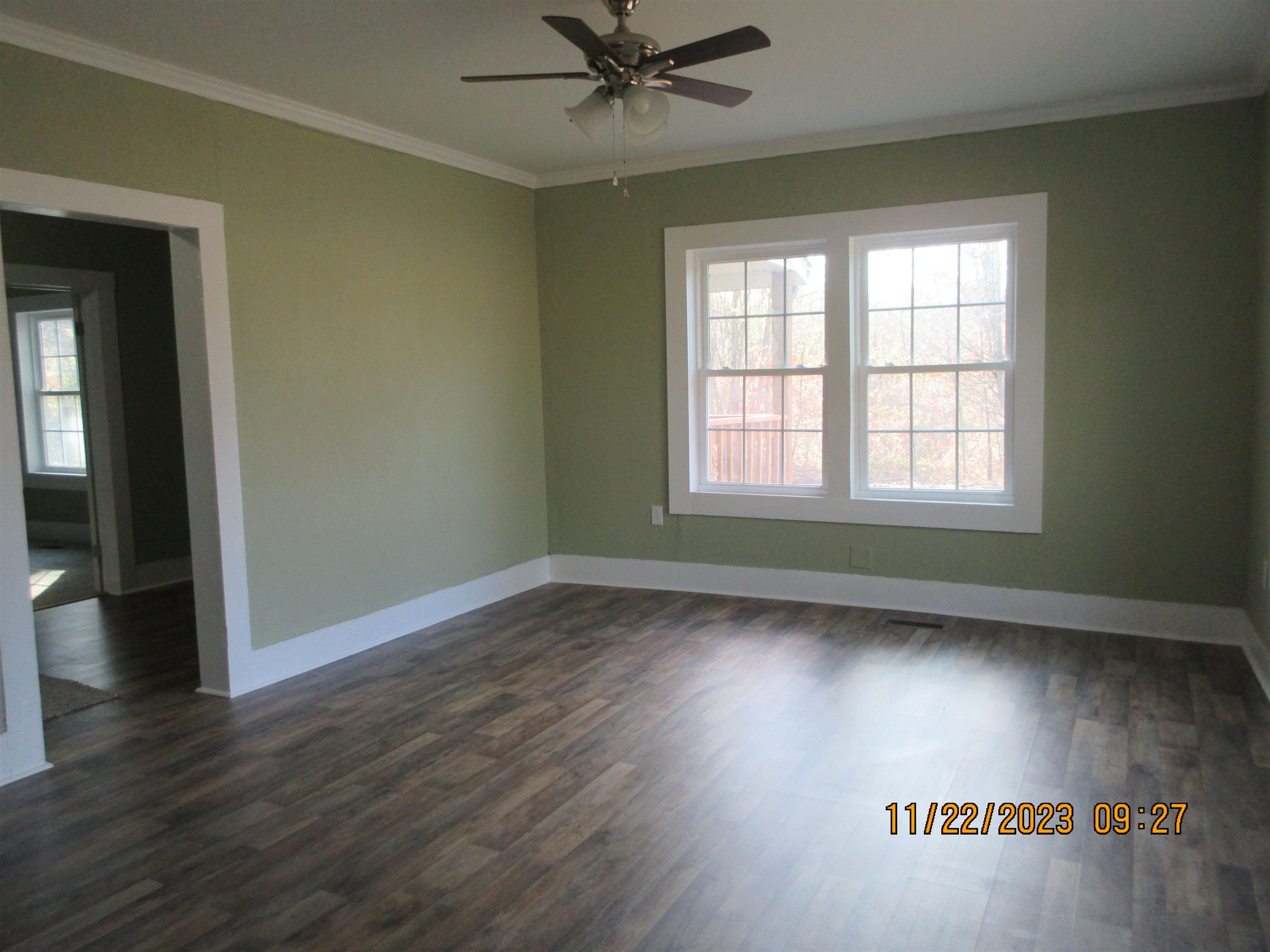 4036 Concord Road Gates, TN 38037 - Photo 5 of 19 an empty room with wooden floor and windows