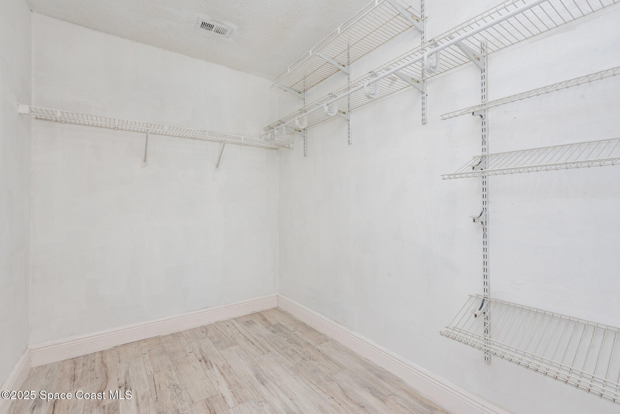 1045 Jacaranda Circle Rockledge, FL 32955 - Photo 15 of 32 a view of a room with racks on the wall