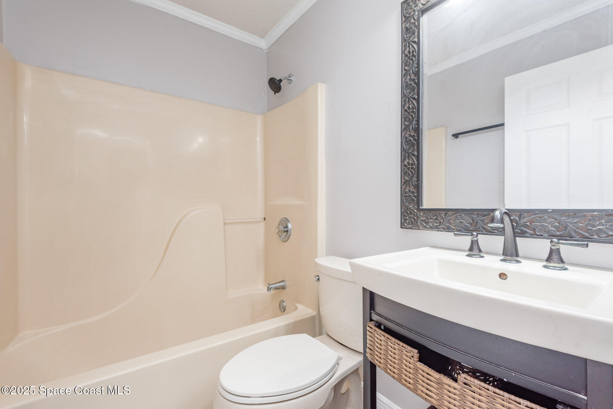 1045 Jacaranda Circle Rockledge, FL 32955 - Photo 20 of 32 a bathroom with a sink toilet and shower