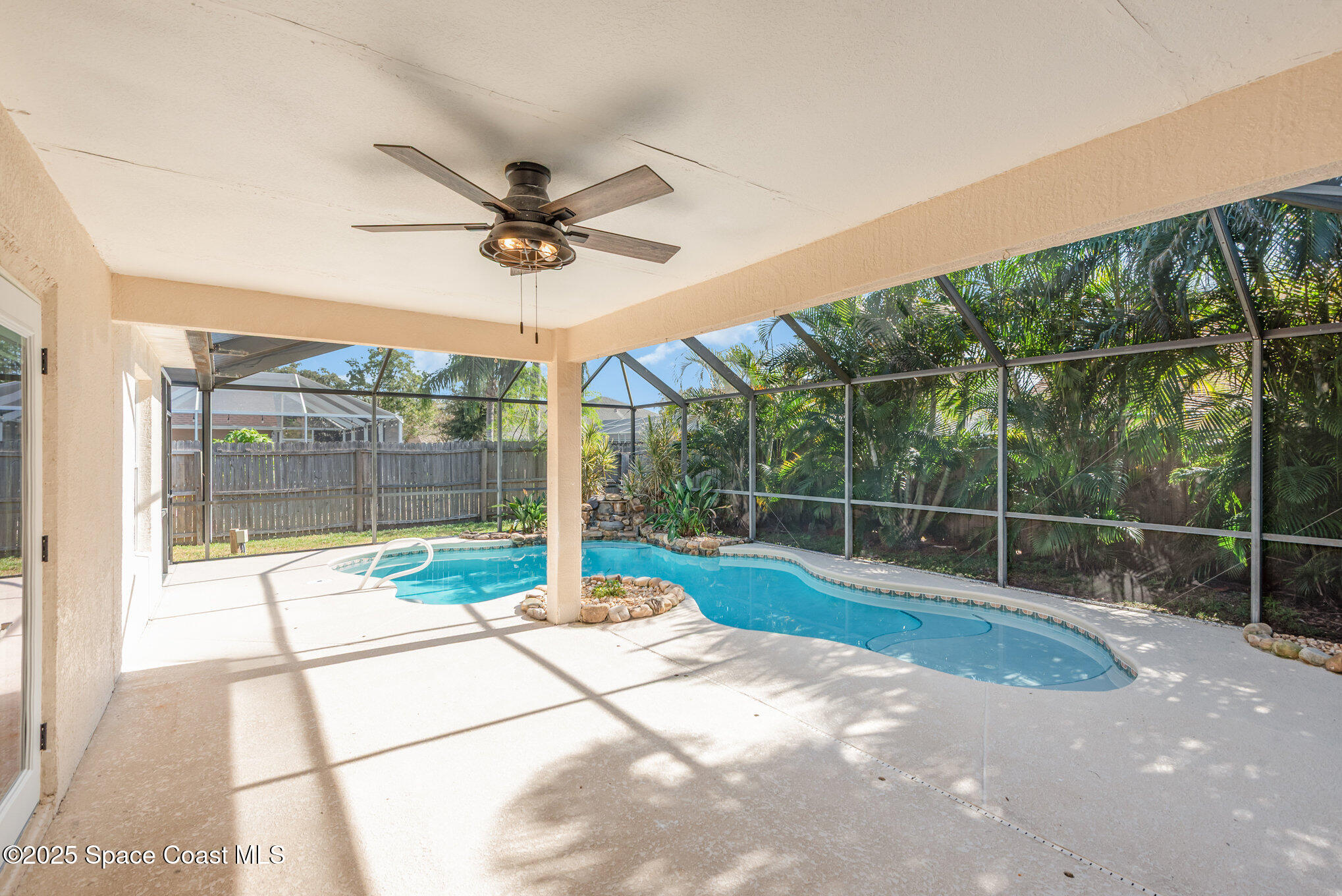 1045 Jacaranda Circle Rockledge, FL 32955 - Photo 21 of 32 a view of a backyard