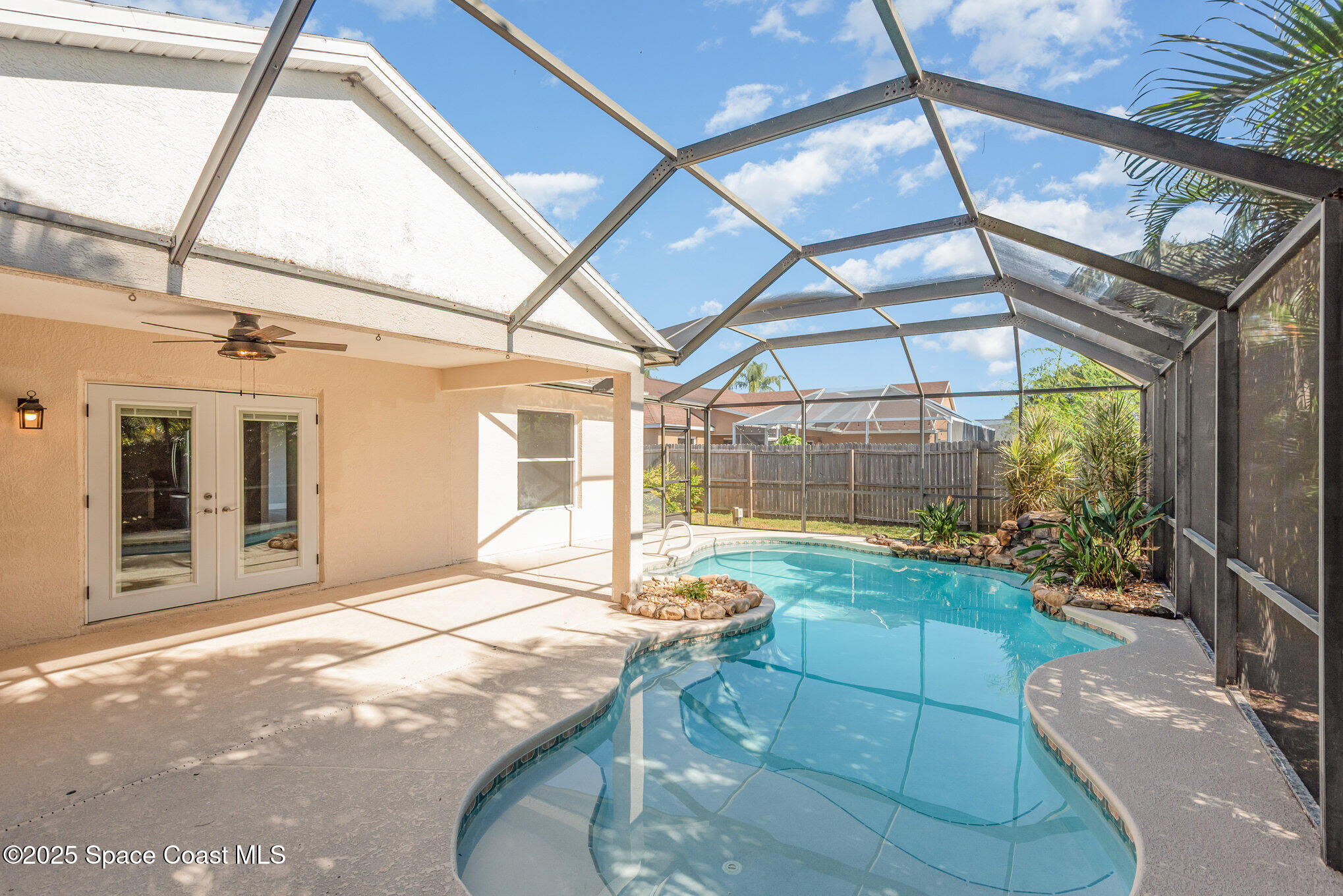1045 Jacaranda Circle Rockledge, FL 32955 - Photo 22 of 32 a view of a porch with a table and chairs