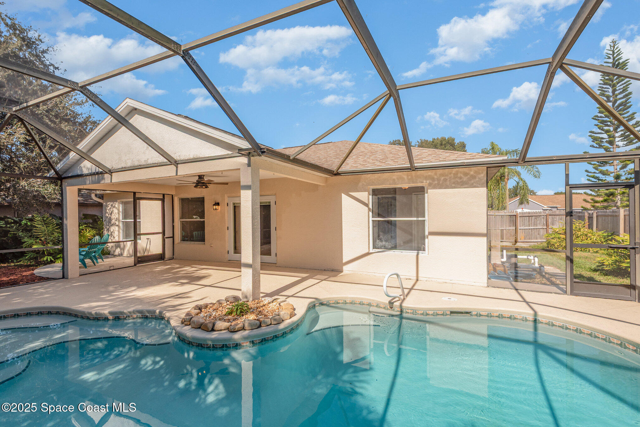 1045 Jacaranda Circle Rockledge, FL 32955 - Photo 23 of 32 a swimming pool with a yard