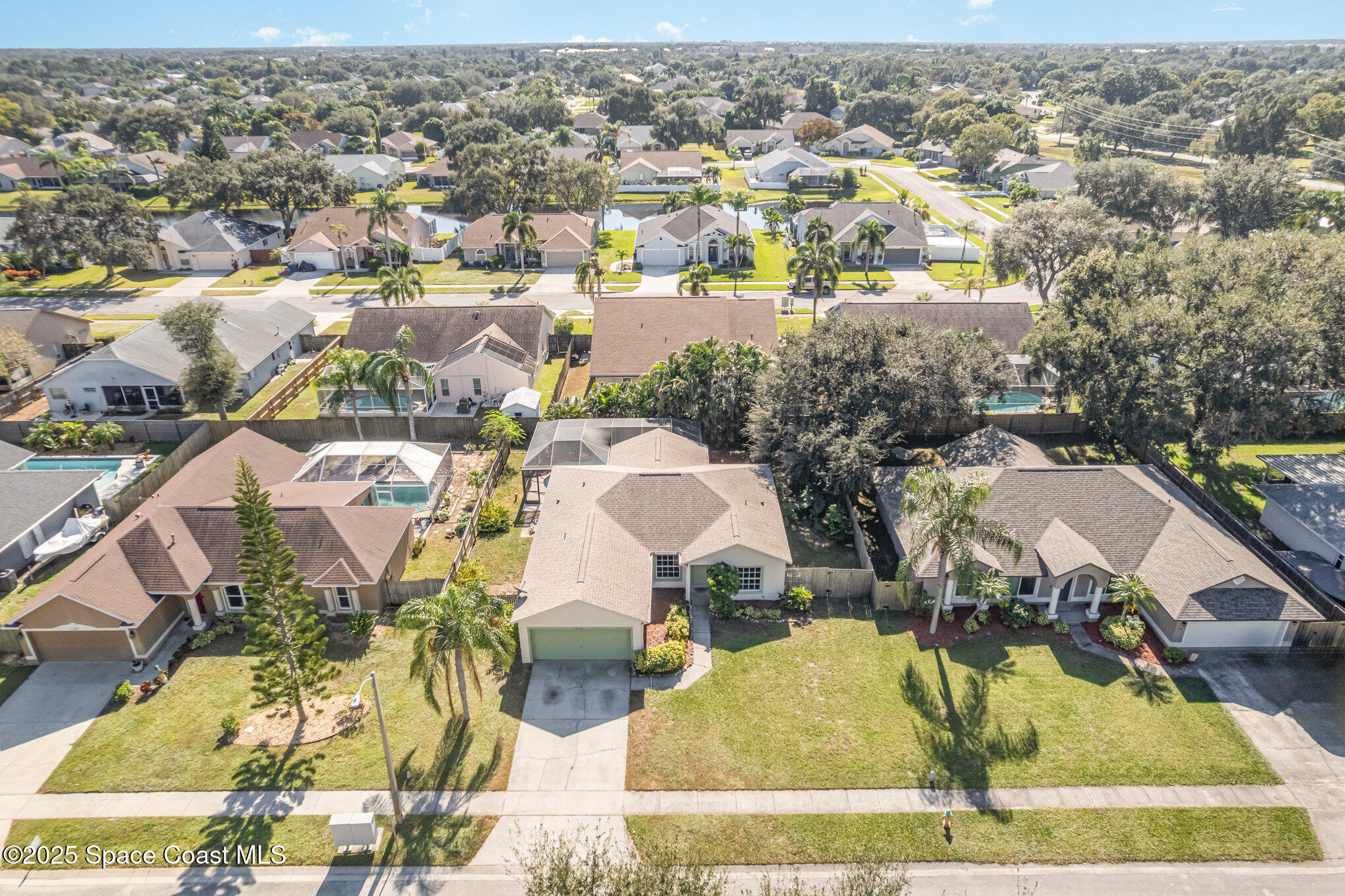1045 Jacaranda Circle Rockledge, FL 32955 - Photo 27 of 32 an aerial view of residential houses with outdoor space