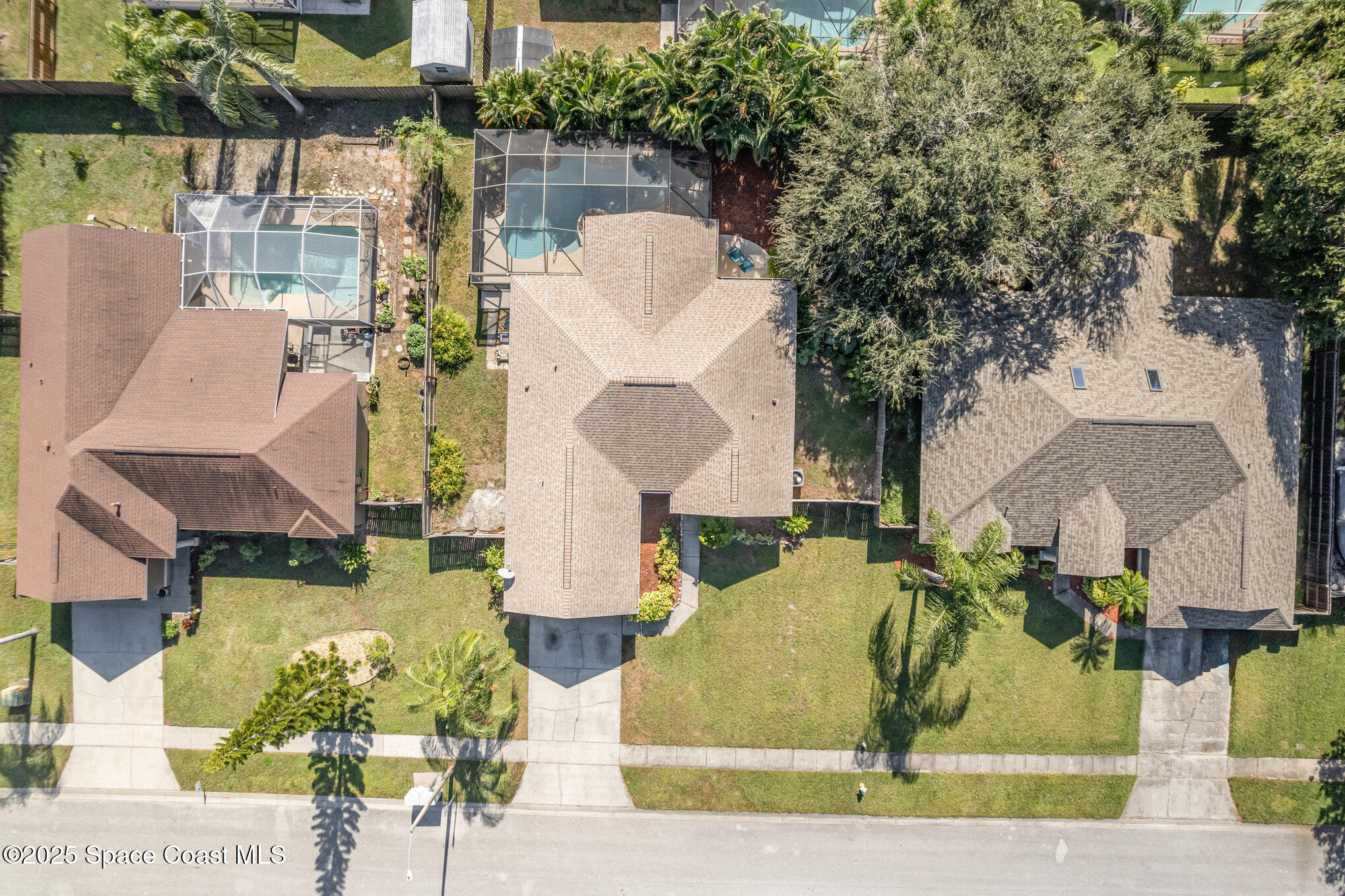 1045 Jacaranda Circle Rockledge, FL 32955 - Photo 28 of 32 an aerial view of a house with swimming pool