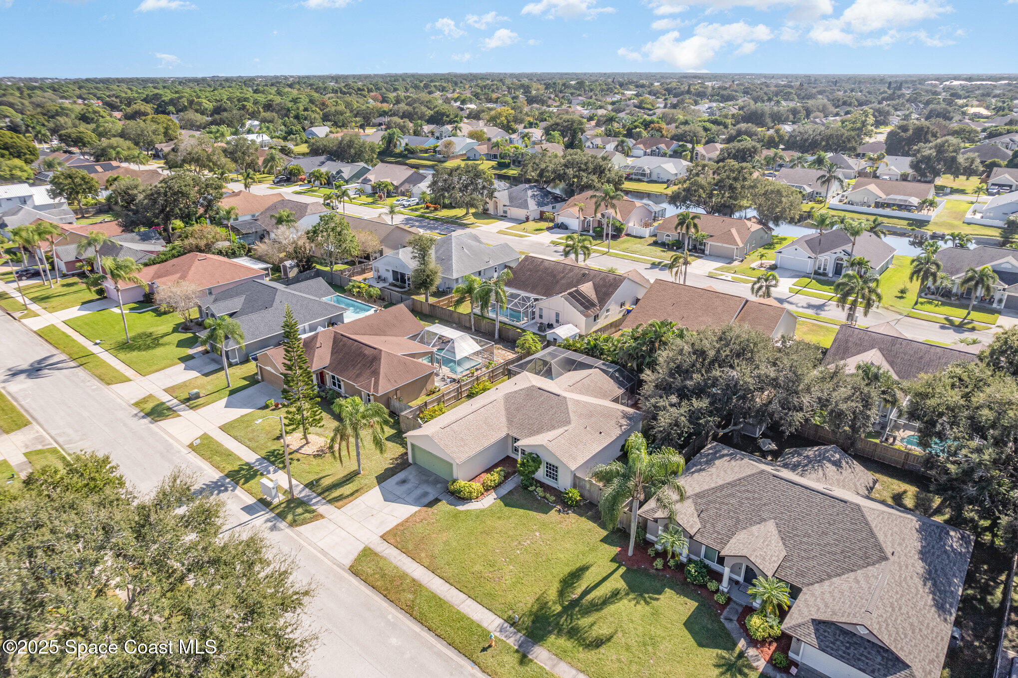 1045 Jacaranda Circle Rockledge, FL 32955 - Photo 29 of 32 an aerial view of residential houses with outdoor space