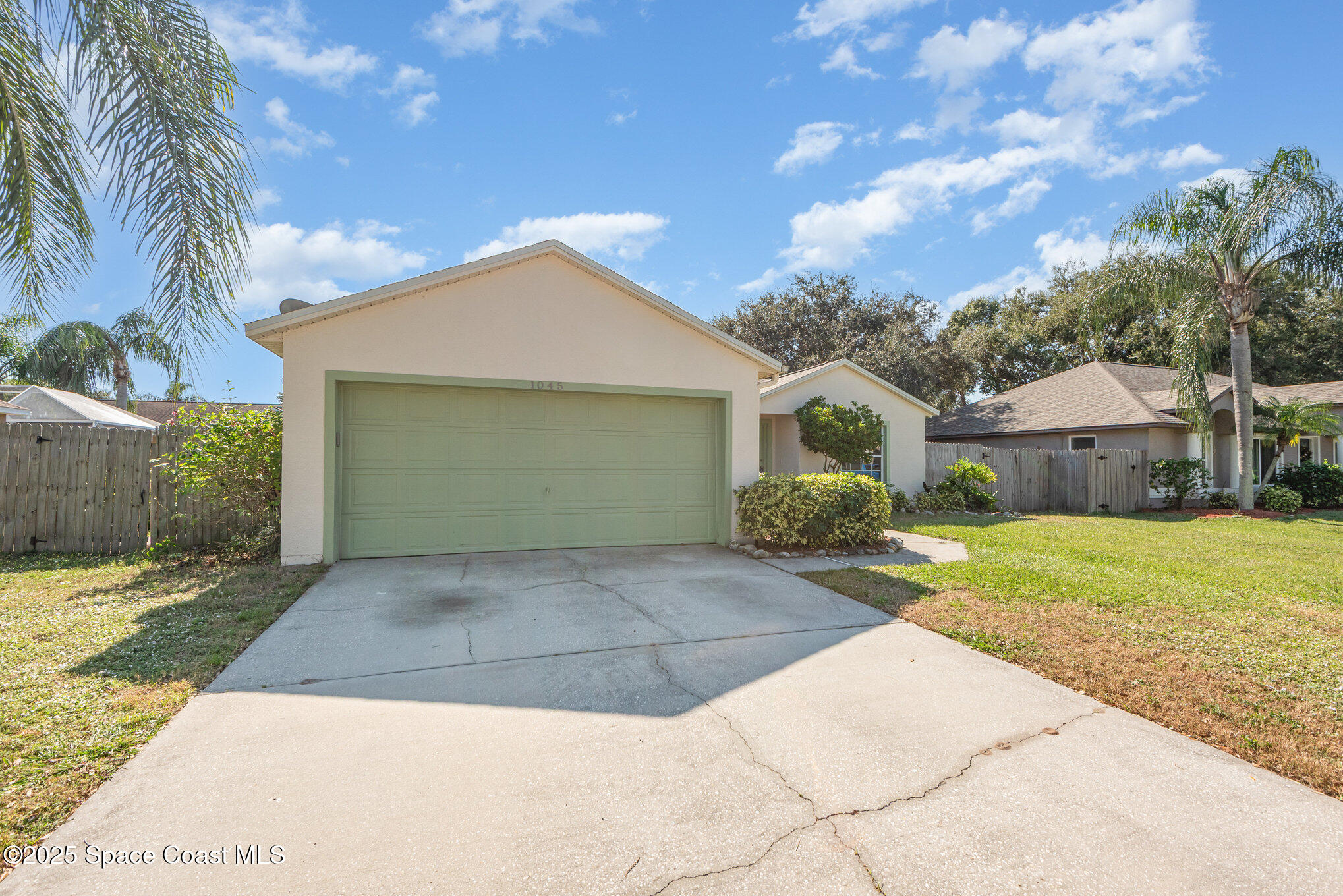 1045 Jacaranda Circle Rockledge, FL 32955 - Photo 31 of 32 a front view of a house with garden