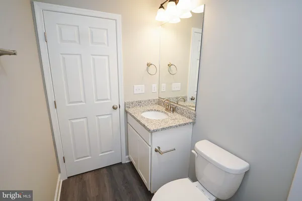 a bathroom with a toilet and a bath tub