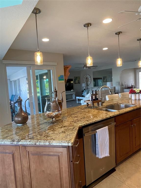 3433 Nighthawk Court Punta Gorda, FL 33950 - Photo 13 of 21 a kitchen with a stove and a chandelier