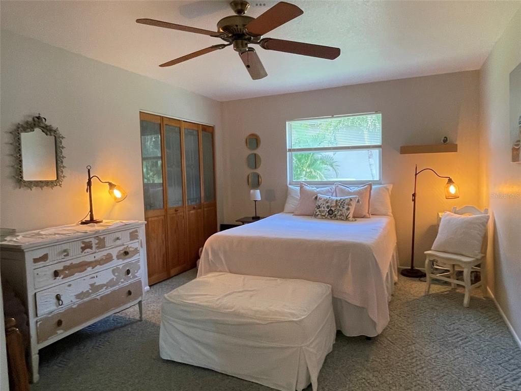 3433 Nighthawk Court Punta Gorda, FL 33950 - Photo 17 of 21 a bedroom with a bed and a window