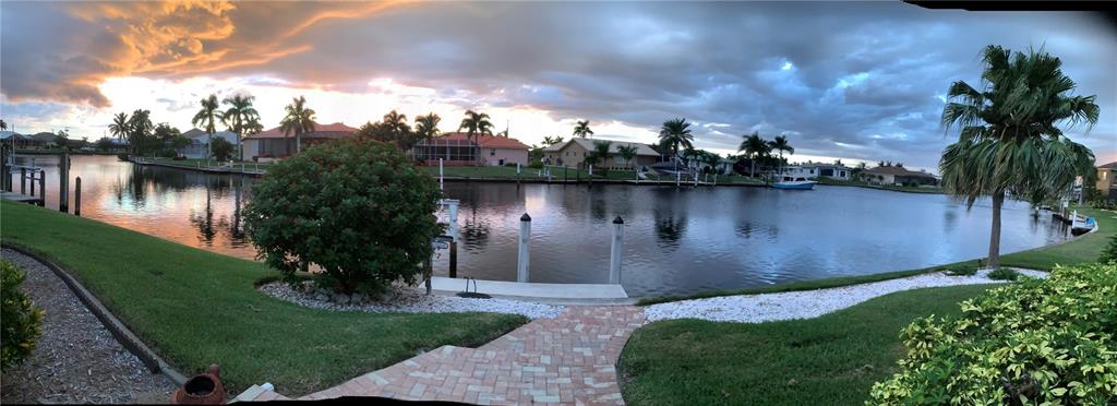 3433 Nighthawk Court Punta Gorda, FL 33950 - Photo 3 of 21 a view of a lake from a yard