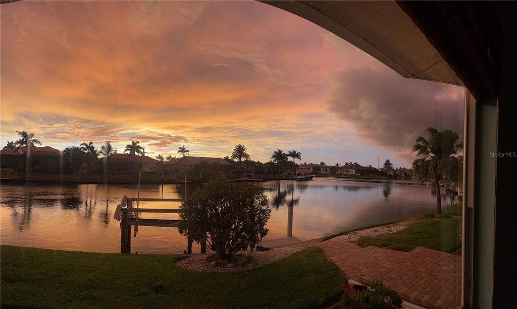 3433 Nighthawk Court Punta Gorda, FL 33950 - Photo 4 of 21 a view of a lake with a mountain in the background