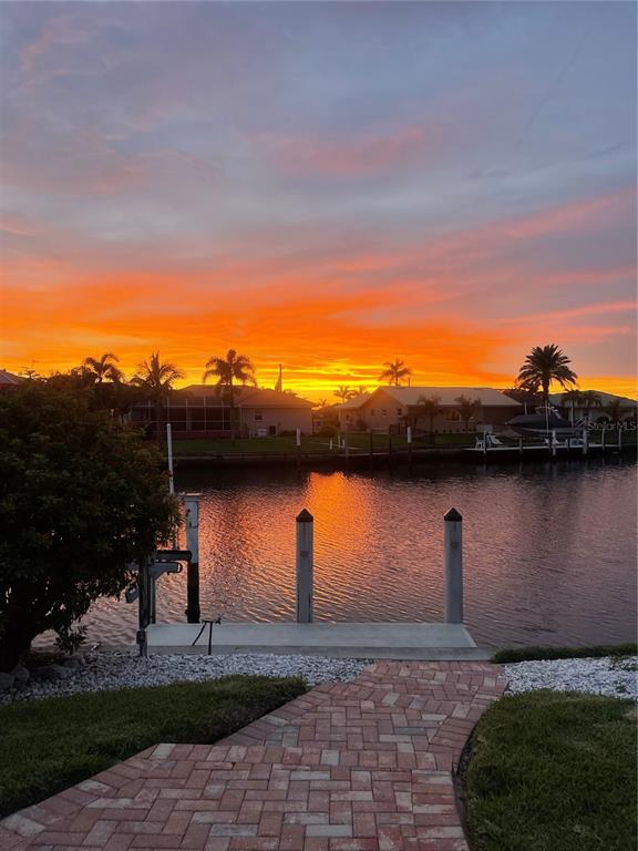 3433 Nighthawk Court Punta Gorda, FL 33950 - Photo 6 of 21 a view of a terrace with a yard