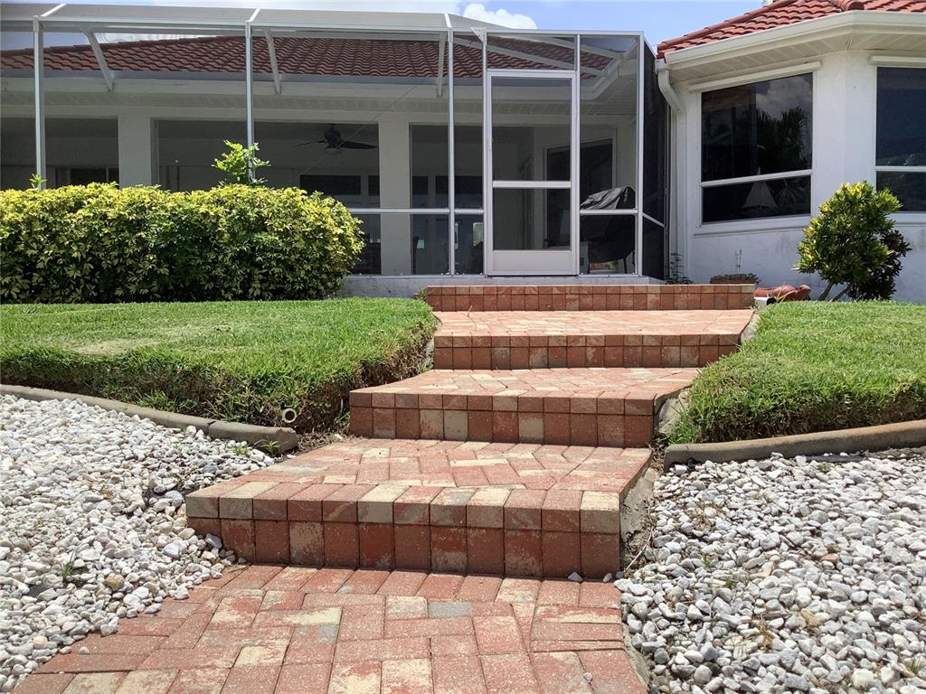 3433 Nighthawk Court Punta Gorda, FL 33950 - Photo 8 of 21 a front view of a house with a yard