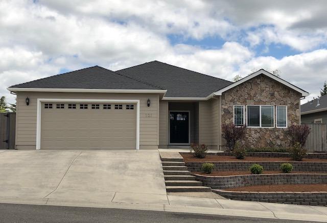 226 Ridgeway Avenue Central Point, OR 97502 - Photo 1 of 31 a front view of a house with entertaining space